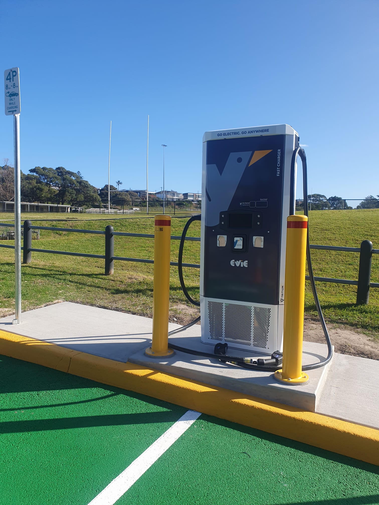 Evie Networks EV charger wrap with Randwick City Council co-branding — Tritium fast charger
