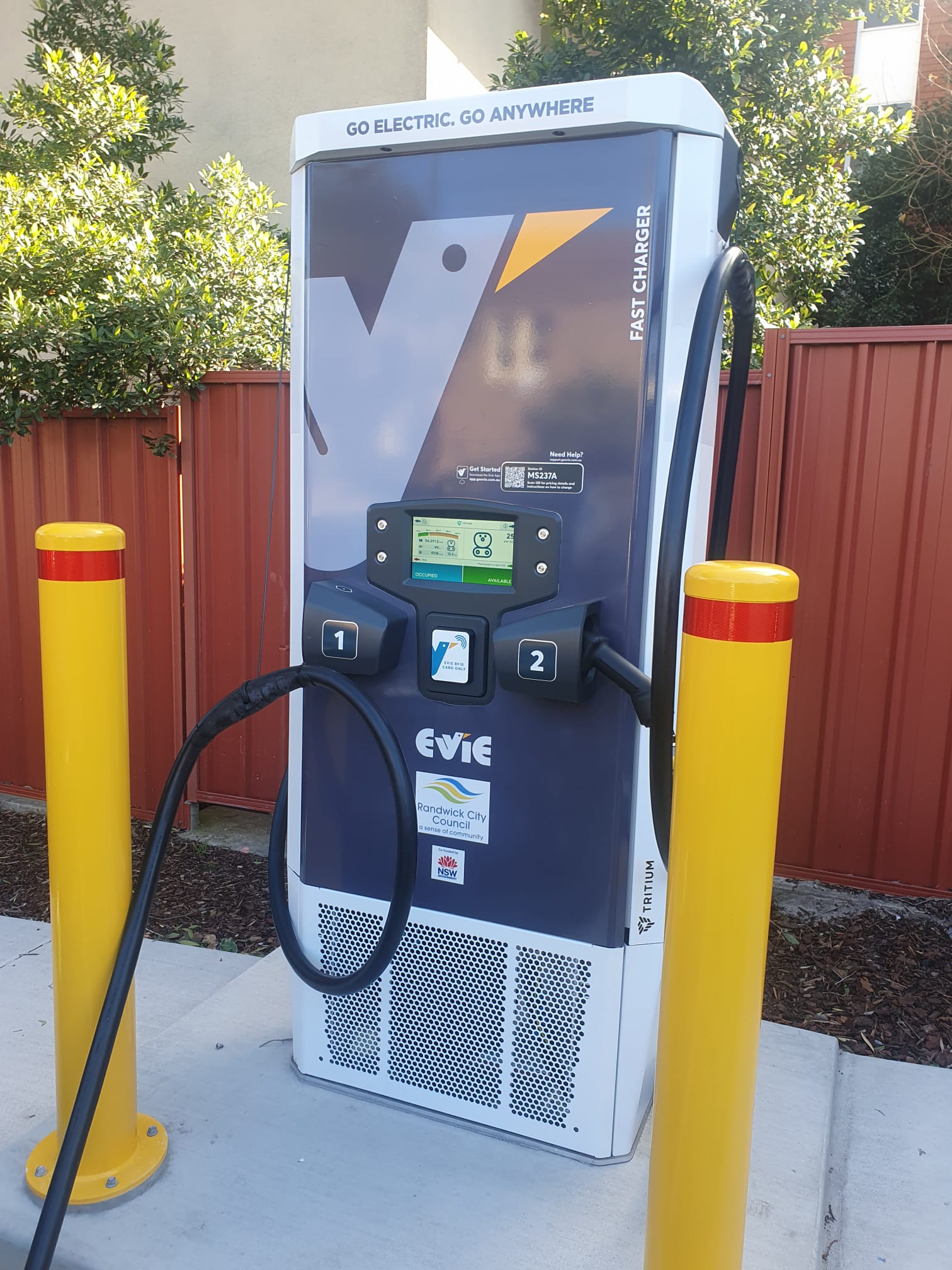 Evie Networks EV charger wrap outdoor installation — Tritium fast charger NSW
