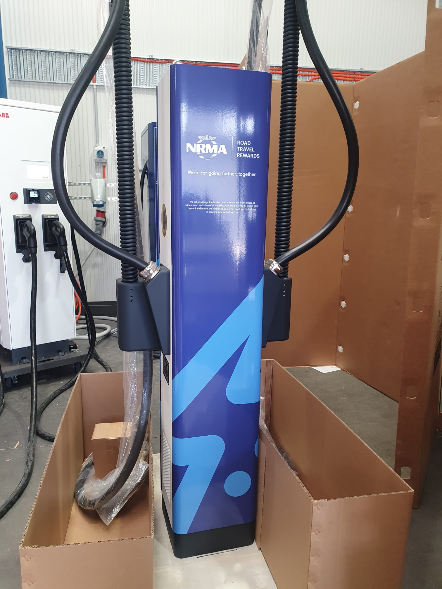 NRMA EV charger wrap being applied in Achurch Signs workshop, North St Marys Sydney
